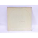 A numbered Beatles 'White Album', no. 0332445, top