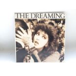 A signed copy of 'The Dreaming' by Kate Bush.