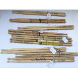 A collection of signed and stage used drumsticks,