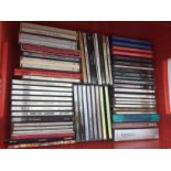 A collection of CDs by various artists including T