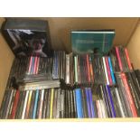 A box of Robbie Williams CDs and DVDs including so