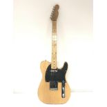 A Fender Telecaster style electric guitar with a m