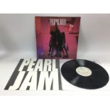 An early pressing of 'Ten' by Pearl Jam. VG+.