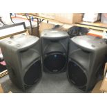 Three Mackie SRM450 speakers.