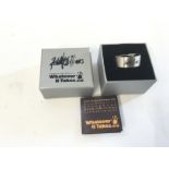 A scarce Robbie Williams signature ring.