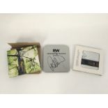 Three signed Robbie Williams CDs comprising 'Under