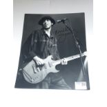 A signed Mick Jones (Clash) photographic print wit