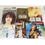 A collection of Madonna tour programs, some with t