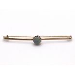 A 14ct bar brooch set with Opal. No visible hallma