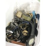 A tub of mixed watches & watch movements, postage