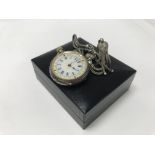 A Swiss silver cased button wind watch with attach