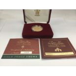 A cased 22ct gold Â£5 gold centenary crown proof coin with COA. Shipping category B.