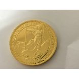 A 2014 gold one ounce Fine Gold Britannia coin. Weight 31.3g