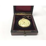 An antique 18ct gold open face key wind watch in a