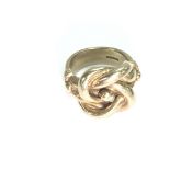 A lovely heavy 9ct gold knot ring. Size X 1/2 & 28