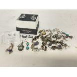 Twenty pairs of silver earrings with various gem s