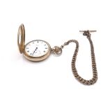 A gold plated half pocket watch with chain winds a