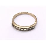 9ct CZ half eternity ring. Approx 1.6g. Ring size