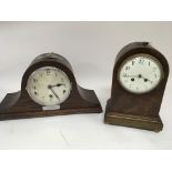 An Edwardian mahogany mantel clock arch shaped wit