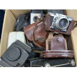 A box of mixed vintage cameras. (D)