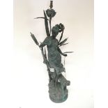 A large early 20th century bronzed lamp figure of