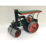 A Mamod steam roller with accessories. Shipping ca