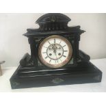 A large black slate and Marble mantel clock with v