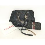 Guess bag and purse with dust case. Postage cat C