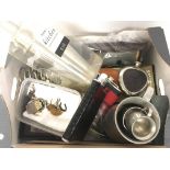 Box of assorted items including hip flasks, pendan