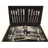 A collection of cased stainless steel cutlery