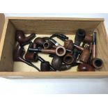 A collection of various pipes including a meerscha