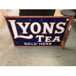 A double sided Lyons tea sign.
