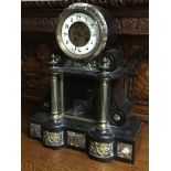 A Victorian slate mantle clock the circular dial w