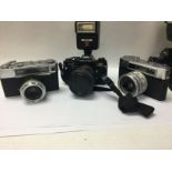 A Pentax camera and two yashica cameras along with