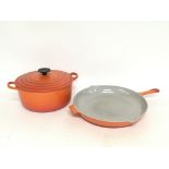 A set of Le-Creuset cooking pots, postage cat D