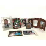 A collection of photograph frames. Postage cat D-N