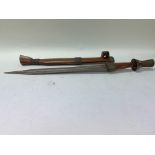 An unusual tribal knife with wooden sheath and han
