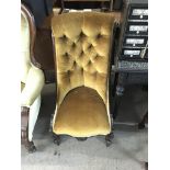 A Victorian mahogany upholstered slipper chair.