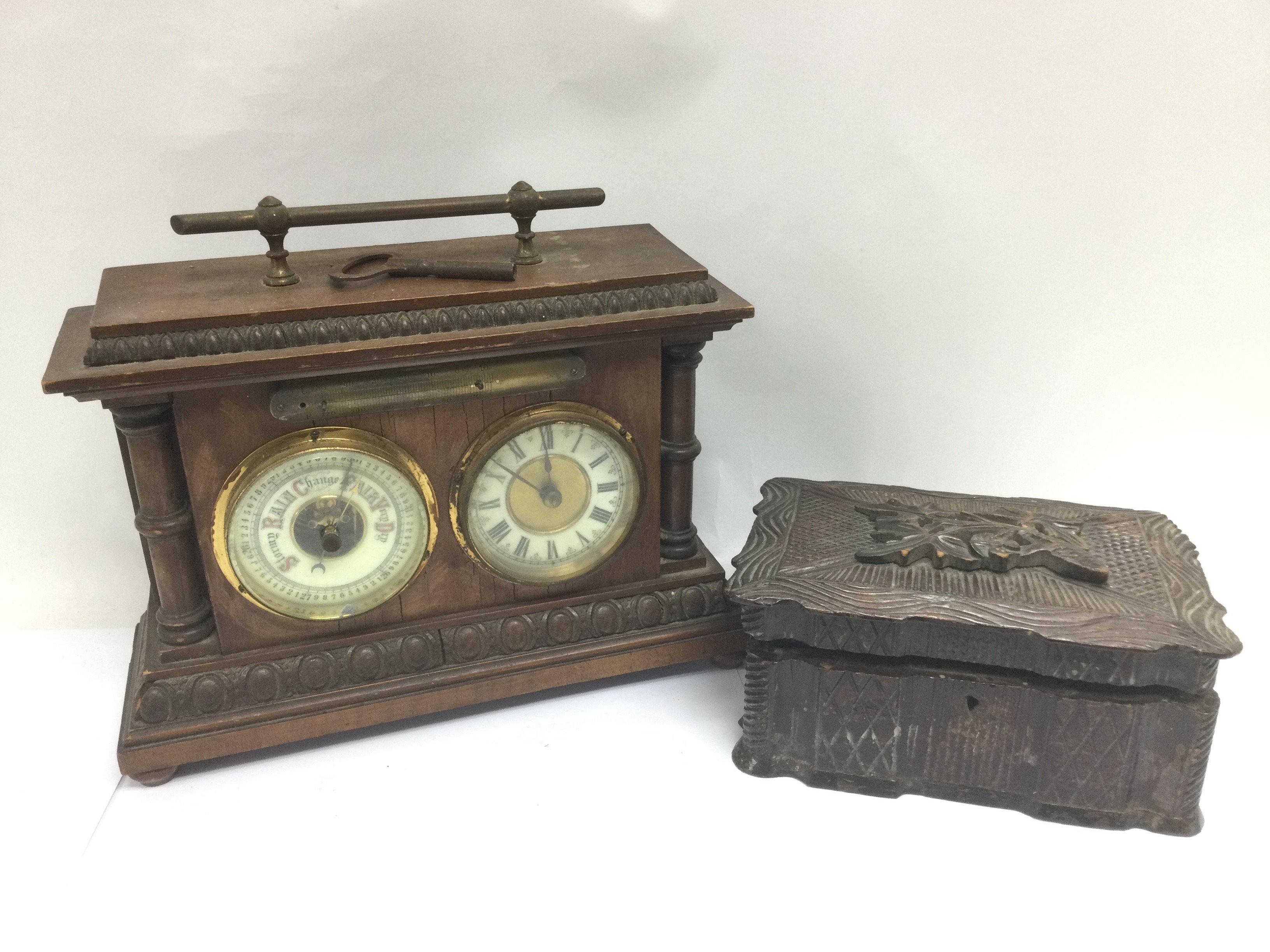 A mahogany cased clock and barometer set together