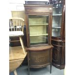 An Edwardian single door inlaid mahogany display c