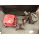 A group of car mechanic tools including a dolly, a