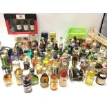 A large collection of miniature bottles including