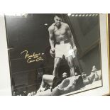 A framed picture of boxing legend Muhammad Ali sig