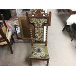 A Victorian walnut priedieu (pray chair). 125cm hi