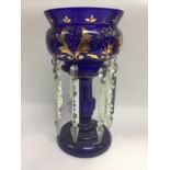 A Victorian blue glass lustre. Shipping category D