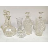 A collection of glass decanters a wheel etched and