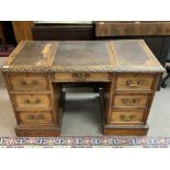 A 1920s Oak pedatal desk with hidden storage secti