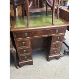 A small mahogany kneehole desk and an occasional t