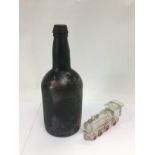An antique glass bottle and an Avor glass train (2