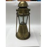 A 1900s bull Pitt and sons ship lamp.